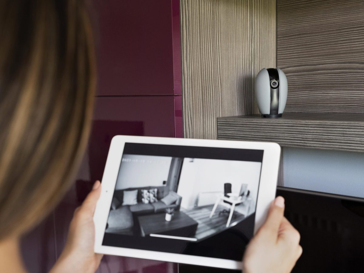close-up-woman-checking-security-camera